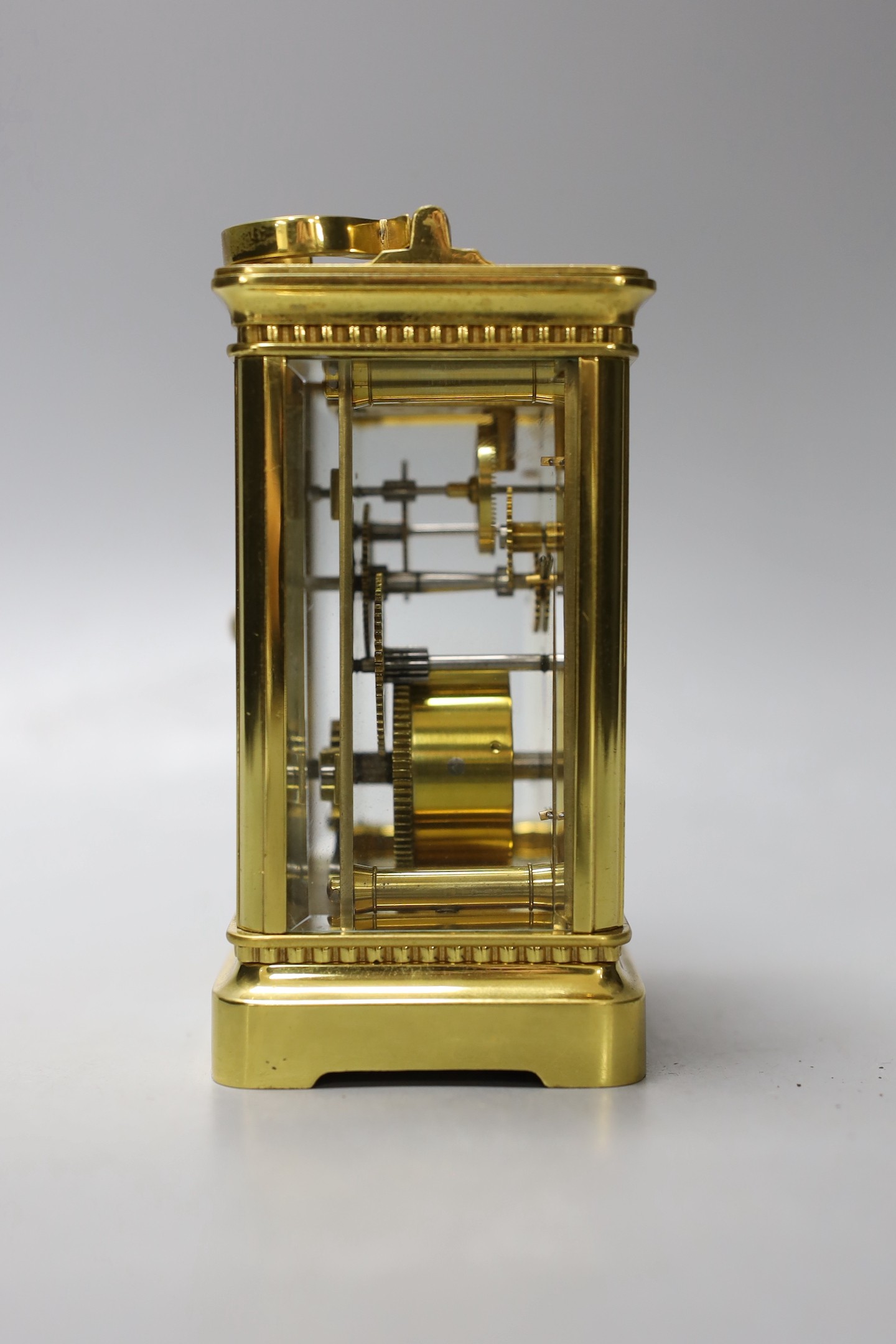 A cased French gilt brass carriage timepiece with relief cast dial and engraved presentation inscription - 14cm tall